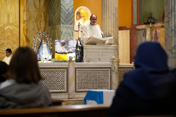 Father Fernando Laguna delivers his message during a thanksgiving mass on the 12th anniversary of Pope Francis election at the Argentinean's church in Rome, Thursday, March 13, 2025. (AP Photo/Gregorio Borgia)