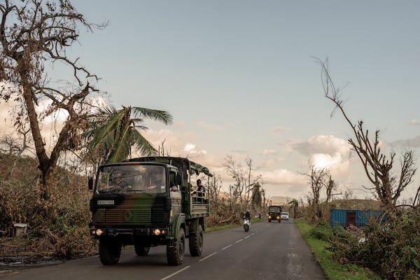 French military vehicles make their way to the central city of Mirereni, Mayotte, Friday, Dec. 20, 2024. (AP Photo/Adrienne Surprenant)