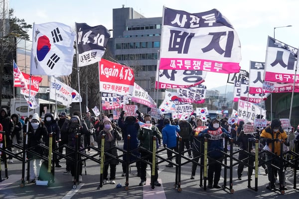 Supporters of impeached South Korean President Yoon Suk Yeol stage a rally to oppose his impeachment near the presidential residence in Seoul, South Korea, Thursday, Jan. 9, 2025. (AP Photo/Ahn Young-joon)