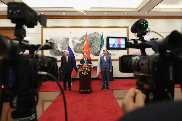 From left, Russian Deputy Foreign Minister Sergei Ryabkov, Chinese Vice Foreign Minister Ma Zhaoxu and Iranian Deputy Foreign Minister Kazem Gharibabadi Meet with reporters after their meeting at Diaoyutai State Guest House on March 14, 2025 in Beijing, China. (Lintao Zhang/Pool Photo via AP)