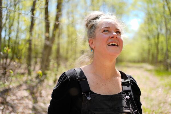 Heather Donahue, the star of the The Blair Witch Project, pauses on a walk to watch a songbird,Tuesday, May 13, 2025, in Freedom, Maine. (AP Photo/Robert F. Bukaty)