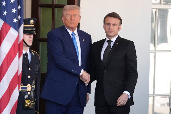 President Donald Trump, left, greets France's President Emmanuel Macron before a news conference at the White House, Monday, Feb. 24, 2025, in Washington. (AP Photo/Manuel Balce Ceneta)