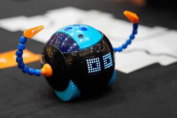 The Cooper robot is on display at the Learning Resources booth at Pepcom ahead of the CES tech show Monday, Jan. 6, 2025, in Las Vegas. The STEM-friendly robot is aimed at helping kids as young as five years old get exposure to the basics of coding. (AP Photo/John Locher)