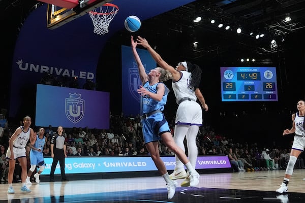 Mist's Courtney Vandersloot (25) aims to score against Lunar Owls Allisha Gray during the Unrivaled inaugural basketball game, Friday, Jan. 17, 2025, in Medley, Fla. (AP Photo/Marta Lavandier)