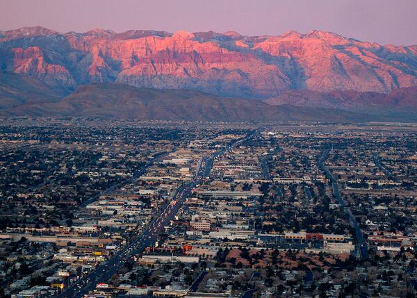 FILE - A view of the suburbs of Las Vegas from atop the Stratosphere tower looking west down Sahara Ave., towards the Spring Mountains, Feb. 9, 2005. (AP Photo/Joe Cavaretta, File)