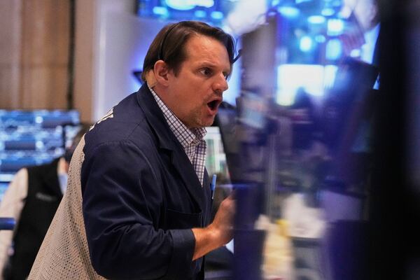 Trader Michael Milano works on the floor of the New York Stock Exchange, Thursday, May 1, 2025. (AP Photo/Richard Drew)