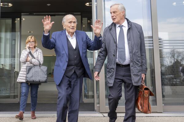 Former Fifa President, Sepp Blatter, centre, and his lawyer Lorenz Erni, right, after the verdict at the special appeals court, in Muttenz, Switzerland, Tuesday, March 25, 2025. (Urs Flueeler/Keystone via AP)