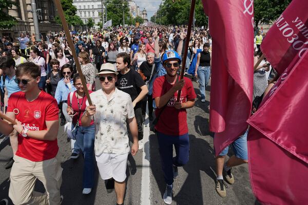 University students and people protest in front of the government building, six months after the deadly train station tragedy that sparked mass demonstrations against corruption, in Belgrade, Serbia, Thursday, May 1, 2025. (AP Photo/Darko Vojinovic)