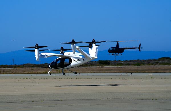 An "electric vertical take-off and landing" aircraft built by Joby Aviation lands at an airfield in Marina, Calif. on Monday, Oct. 7, 2024. (AP Photo/Terry Chea)