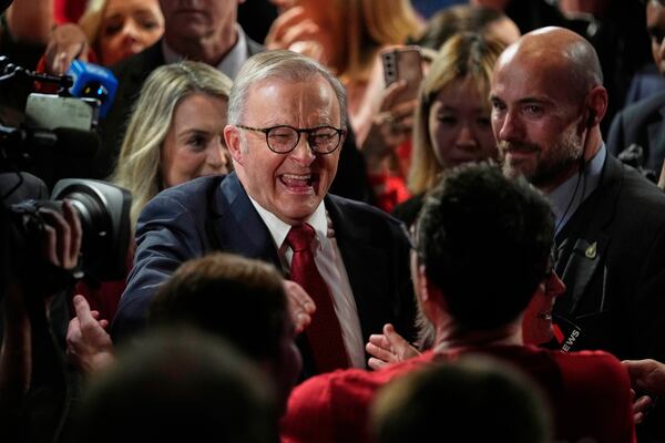 Australian Prime Minister Anthony Albanese reacts as he meets party faithful after winning a second term of the general election in Sydney, Saturday, May 3, 2025. (AP Photo/Rick Rycroft)