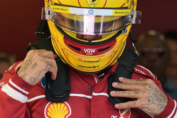 Ferrari driver Lewis Hamilton of Britain prepares for qualifying at the Australian Formula One Grand Prix at Albert Park, in Melbourne, Australia, Saturday, March 15, 2025. (Tracey Nearmy/Pool Photo via AP)