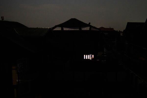 A Kashmiri man looks out from the window of his house during blackout after the residents of the Srinagar reported hearing explosions in Srinagar, Indian controlled Kashmir, Saturday, May 10, 2025.(AP Photo/Dar Yasin)