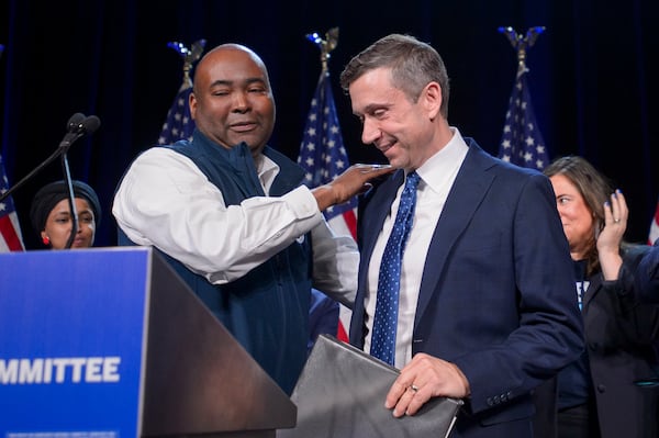 Former Democratic National Committe Chairman Jamie Harrison, left, congratulates newly elected DNC Chairman Ken Martin, right, after Martin won the vote at the Democratic National Committee Winter Meeting at the Gaylord National Resort and Convention Center in National Harbor, Md., Saturday, Feb. 1, 2025. (AP Photo/Rod Lamkey, Jr.)