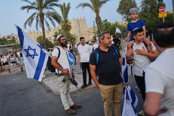 Israelis participate in a march marking Jerusalem Day, an Israeli holiday celebrating the capture of east Jerusalem in the 1967 Mideast war, in Jerusalem, Monday, May 26, 2025. (AP Photo/Ohad Zwigenberg)