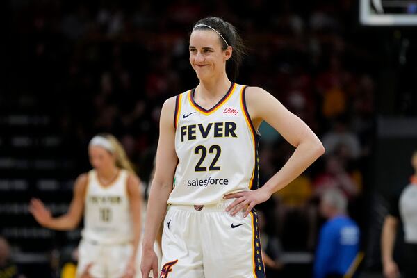 Indiana Fever guard Caitlin Clark reacts to a fan during the first half of an exhibition women's basketball game against Brazil, Sunday, May 4, 2025, in Iowa City, Iowa. (AP Photo/Charlie Neibergall)