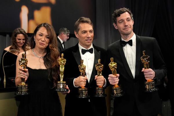 Samantha Quan, from left, winner of the award for best picture for "Anora, Sean Baker, winner of the awards for best original screenplay, best film editing, best director, and best picture for "Anora," and Alex Coco, winner of the award for best picture for "Anora," attend the Governors Ball after the Oscars on Sunday, March 2, 2025, in Los Angeles. (AP Photo/John Locher)