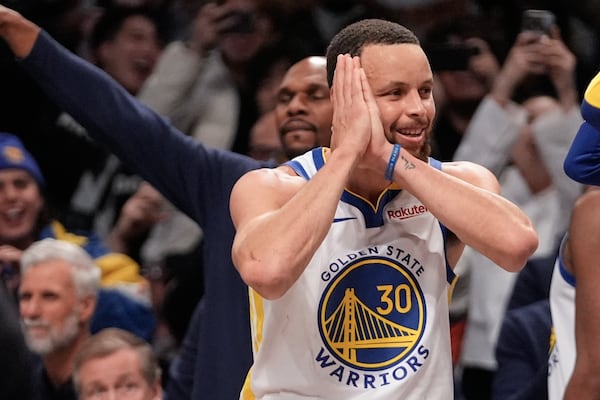 Golden State Warriors' Stephen Curry (30) gestures after making a three-point shot during the second half of an NBA basketball game against the Brooklyn Nets Thursday, March 6, 2025, in New York. (AP Photo/Frank Franklin II)