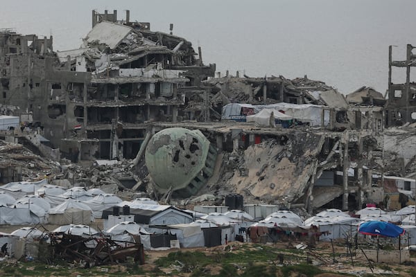 A tent camp for displaced Palestinians is set up amid destroyed buildings in the west of Al-Shati camp, west of Gaza City, on Monday, March 3, 2025. (AP Photo/Jehad Alshrafi)