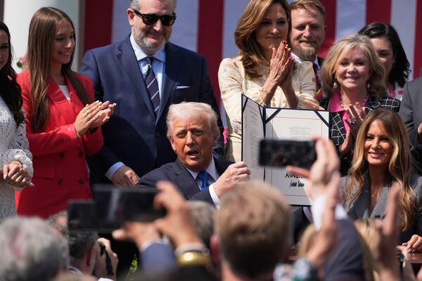 President Donald Trump, with first lady Melania Trump and others, after signing the "Take It Down Act" during a ceremony in the Rose Garden at the White House, Monday, May 19, 2025. (AP Photo/Manuel Balce Ceneta)