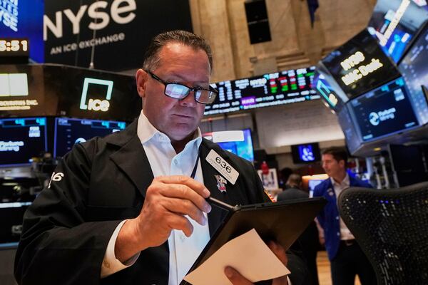 Trader Edward Curran works on the floor of the New York Stock Exchange, Wednesday, May 7, 2025. (AP Photo/Richard Drew)