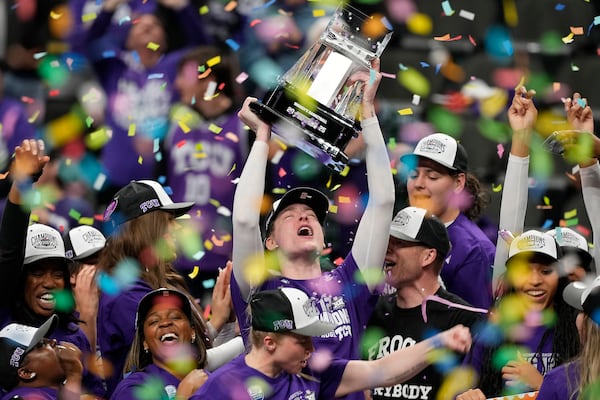 TCU players celebrate after winning an NCAA college basketball game for the Big 12 women's tournament championship against Baylor Sunday, March 9, 2025, in Kansas City, Mo. (AP Photo/Charlie Riedel)