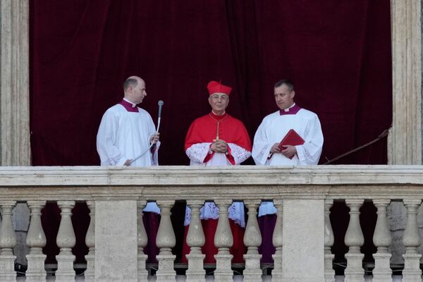 Cardinal Dominique Mamberti announces the election of Cardinal Robert F. Prevost as the 267th pope, choosing the name of Pope Leone XIV, at the Vatican, Thursday, May 8, 2025. (AP Photo/Bernat Armangue)