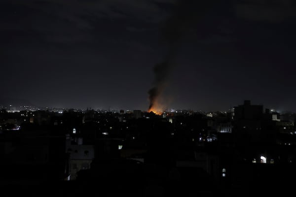 Smoke rises from a location reportedly struck by U.S. airstrikes in Sanaa, Yemen, Wednesday, March 19, 2025. (AP Photo/Osamah Abdulrahman)