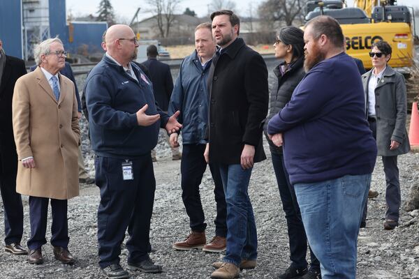 Vice President JD Vance, center, speaks with East Palestine Fire Chief Keith Drabick during a visit to East Palestine, Ohio, on Monday, Feb. 3, 2025. (Rebecca Droke/Pool Photo via AP)