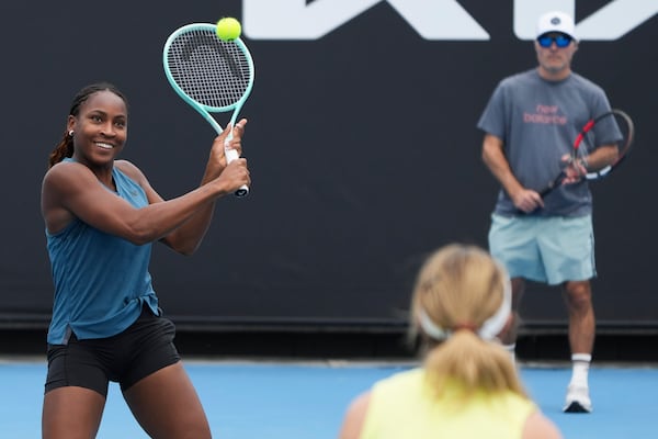 Coco Gauff of the United States plays a backhand return compatriot Danielle Collins during a practice session ahead of the Australian Open tennis championship in Melbourne, Australia, Thursday, Jan. 9, 2025. (AP Photo/Mark Baker)