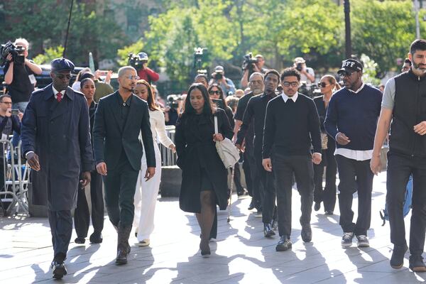 Family and supporters of Sean "Diddy" Combs, including his sons Quincy Brown, second from left, and Justin Combs, third from right, arrive to the courthouse in New York, Monday, May 12, 2025. (AP Photo/Seth Wenig)