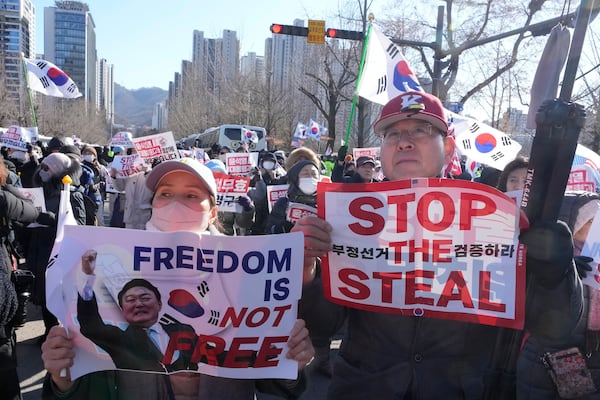 Supporters of impeached South Korean President Yoon Suk Yeol attend a rally to oppose his impeachment near the Corruption Investigation Office for High-Ranking Officials in Gwacheon, South Korea, Wednesday, Jan. 15, 2025. (AP Photo/Ahn Young-joon)