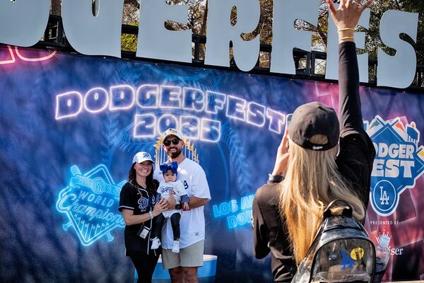 Los Angeles Dodgers baseball fans have a photo taken at DodgerFest at Dodger Stadium, Saturday, Feb. 1, 2025 in Los Angeles. (AP Photo/Richard Vogel)