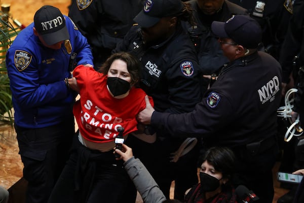 New York Police officers arrest a demonstrator from the group, Jewish Voice for Peace, who protested inside Trump Tower in support of Columbia graduate student Mahmoud Khalil, Thursday, March 13, 2025, in New York. (AP Photo/Yuki Iwamura)