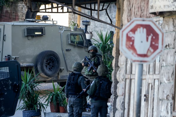 Israeli forces are seen during an army operation in the West Bank city of Nablus, Tuesday, Feb. 25, 2025. (AP Photo/Majdi Mohammed)