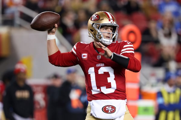 San Francisco 49ers quarterback Brock Purdy (13) throws a pass during the first half of an NFL football game against the Detroit Lions, Monday, Dec. 30, 2024, in Santa Clara, Calif. (AP Photo/Jed Jacobsohn)