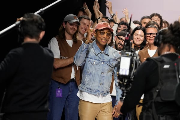 Pharrell Williams reacts after the men's Louis Vuitton Fall-Winter 2025-2026 collection, that was presented in Paris, Tuesday, Jan. 21, 2025. (AP Photo/Michel Euler)