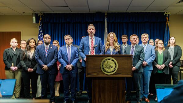 Acting U.S. Attorney Lisa Kirkpatrick, center, speaks during a press conference at the Minneapolis federal courthouse, Wednesday, March 19, 2025, in Minneapolis, after a jury found the alleged ringleader of a massive pandemic fraud case in Minnesota guilty on all counts for her role in a scheme that federal prosecutors say stole $250 million from a program meant to feed children in need. (Kerem Yücel/Minnesota Public Radio via AP)