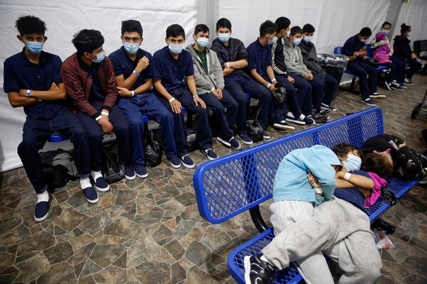 FILE - In this March 30, 2021, file photo, young unaccompanied migrants wait for their turn at the secondary processing station inside the U.S. Customs and Border Protection facility, the main detention center for unaccompanied children in the Rio Grande Valley, in Donna, Texas. (AP Photo/Dario Lopez-Mills, Pool, File)