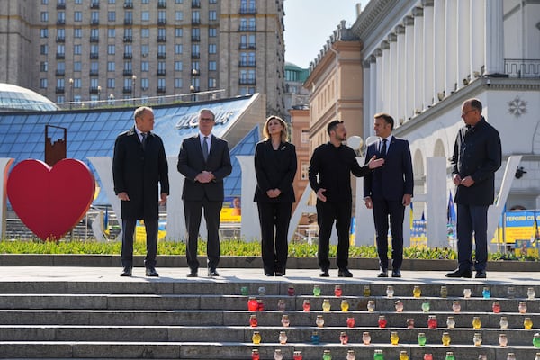 From left, Polish Prime Minister Donald Tusk, U.K. Prime Minister Keir Starmer, Ukraine's First Lady Olena Zelenska Olena Zelenska,Ukrainian President Volodymyr Zelenskyy, French President Emmanuel Macron and German Chancellor Friedrich Merz stand at the memorial of fallen Ukrainian soldiers at independence square in Kyiv, Ukraine, on Saturday, May 10, 2025. (AP Photo/Evgeniy Maloletka)