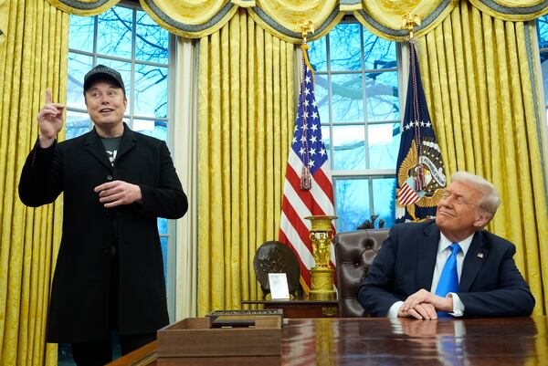 President Donald Trump listens as Elon Musk speaks in the Oval Office at the White House, Tuesday, Feb. 11, 2025, in Washington. (Photo/Alex Brandon)