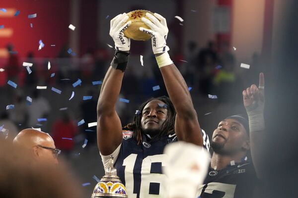 Penn State tight end Khalil Dinkins (16) celebrates after the Fiesta Bowl College Football Playoff game against Boise State, Tuesday, Dec. 31, 2024, in Glendale, Ariz. (AP Photo/Rick Scuteri)