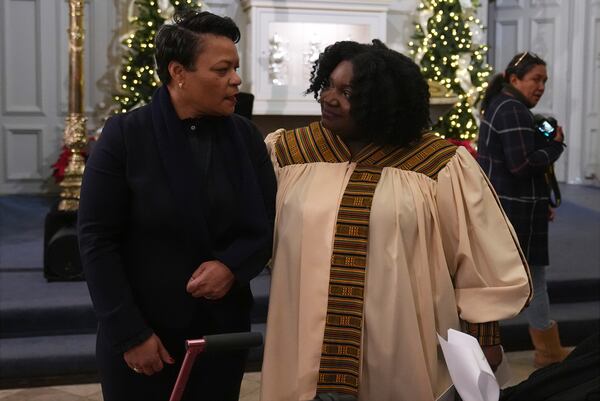 New Orleans Mayor LaToya Cantrell, left, greets choir member Renee Dolliole before an interfaith prayer service for the victims of the deadly New Years truck attack, at St. Louis Cathedral in New Orleans, Monday, Jan. 6, 2025. (AP Photo/Gerald Herbert)