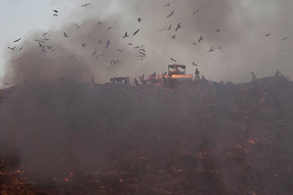 Smoke rises from a garbage dump in Ahmedabad, India, on Feb. 5, 2025. (AP Photo/Ajit Solanki)