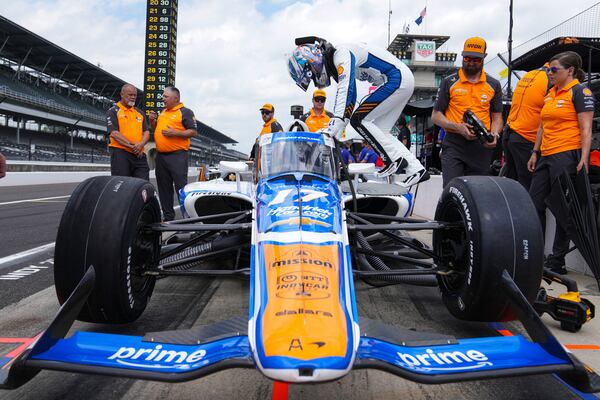 Kyle Larson climbs into his car during practice for the Indianapolis 500 auto race at Indianapolis Motor Speedway in Indianapolis, Thursday, May 15, 2025. (AP Photo/Michael Conroy)