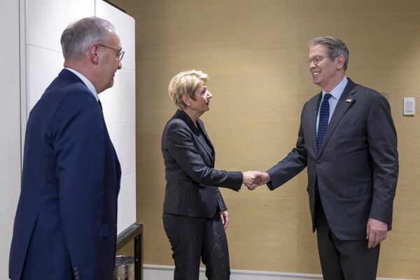 US Secretary of the Treasury Scott Bessent, right, shakes hands with Switzerland's President Karin Keller-Sutter, center, next to Switzerland's Economy Minister Federal Councillor Guy Parmelin, left, during a bilateral meeting between Switzerland and the United States, in Geneva, Switzerland, on Friday, May 9, 2025. (Martial Trezzini/Keystone via AP)