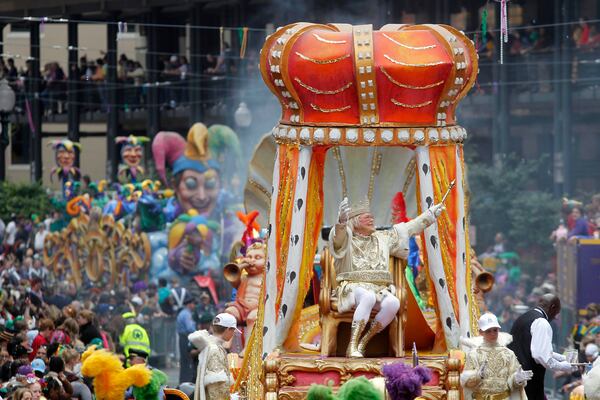 FILE - Rex, the King of Carnival, rides in the Krewe of Rex as he arrives at Canal St. on Mardi Gras day in New Orleans, March 8, 2011. (AP Photo/Gerald Herbert, File)