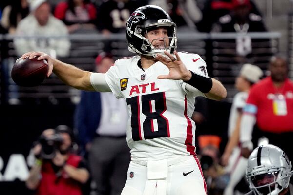 Atlanta Falcons quarterback Kirk Cousins (18) throws against the Las Vegas Raiders during the first half of an NFL football game, Monday, Dec. 16, 2024, in Las Vegas. (AP Photo/Rick Scuteri)