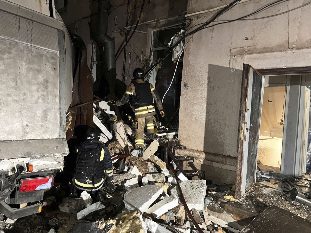 In this photo, provided by Dnipropetrovsk Oblast Governor Serhiy Lysak, firefighters work on the site of a damaged building after a Russian missile attack in Kryvyi Rih, Ukraine, Thursday, March 6, 2025. (Dnipropetrovsk Oblast Governor Serhiy Lysak via AP)