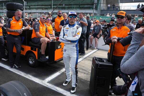 Kyle Larson watches with his crew as he waits for is turn during qualification for the Indianapolis 500 auto race at Indianapolis Motor Speedway in Indianapolis, Saturday, May 17, 2025. (AP Photo/Michael Conroy)