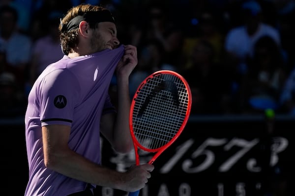 Taylor Fritz of the U.S. reacts during his third Rond match against Gael Monfils of France at the Australian Open tennis championship in Melbourne, Australia, Saturday, Jan. 18, 2025. (AP Photo/Manish Swarup)